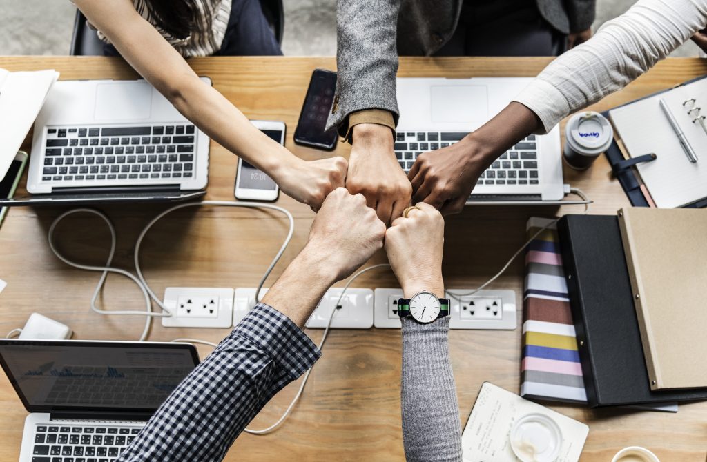 Colleagues giving a fist bump